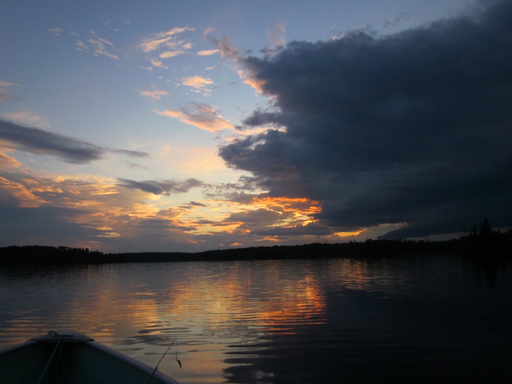 Sunset clouds reflected in calm water