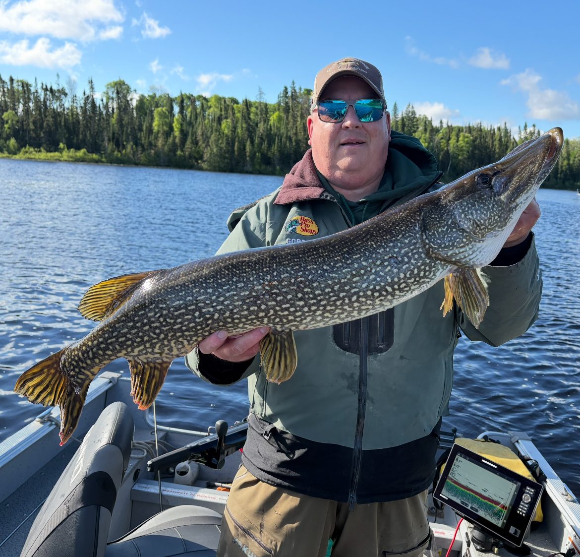 Guest with a smallmouth bass on Little Bear Lake
