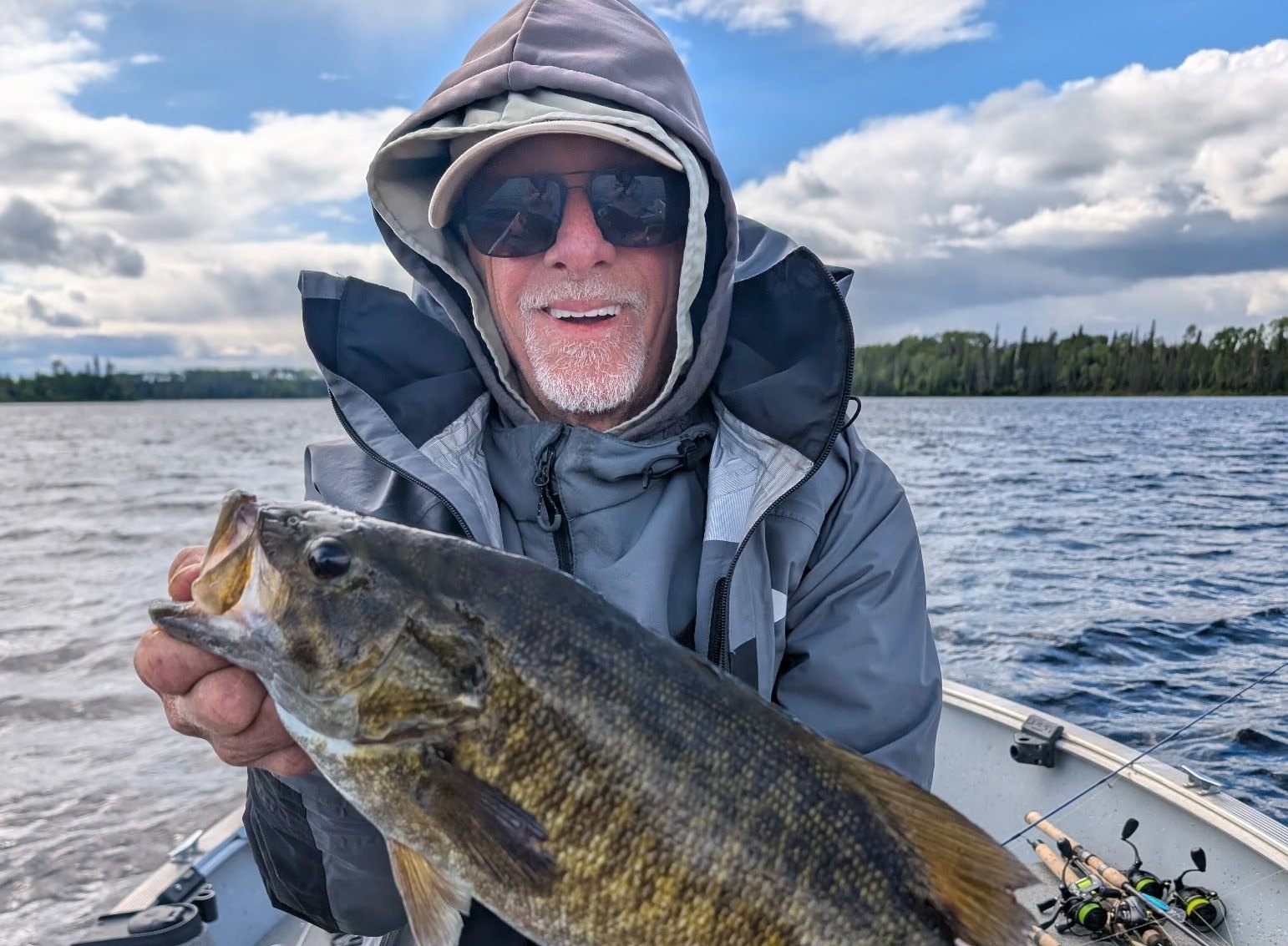 Guest with a smallmouth bass on the Woman River Chain